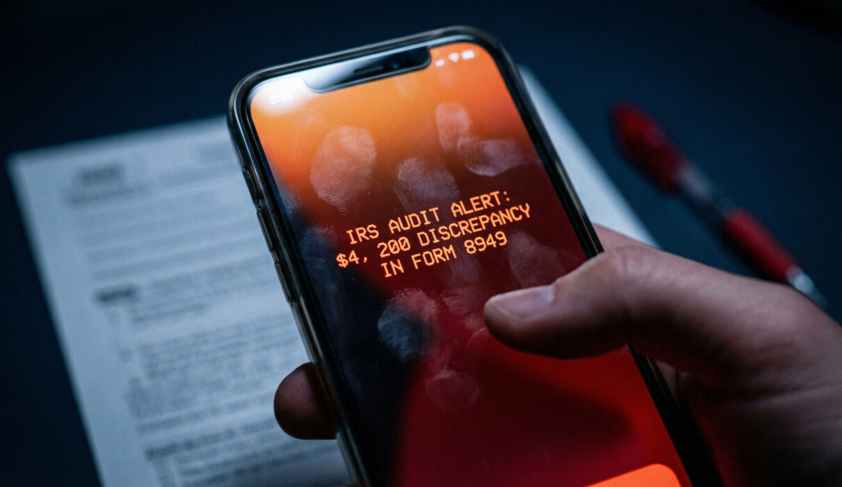 Mobile-first view of a smartphone showing a $4,200 IRS audit alert for AI tax reconciliation errors